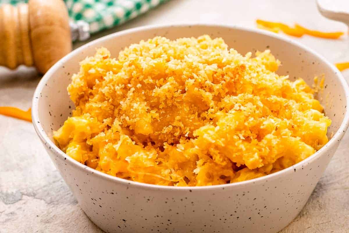 Bowl of baked macaroni and cheese with breadcrumb topping