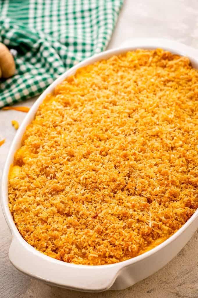 Baked mac and cheese with breadcrumb topping in white casserole dish