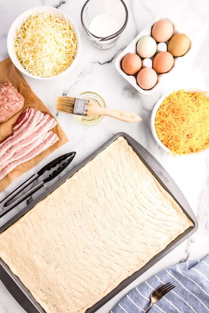 Overhead image of pizza dough in pan