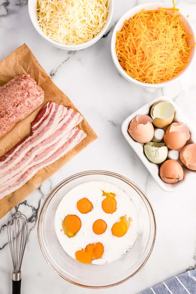 Overhead image of glass bowl with milk and eggs