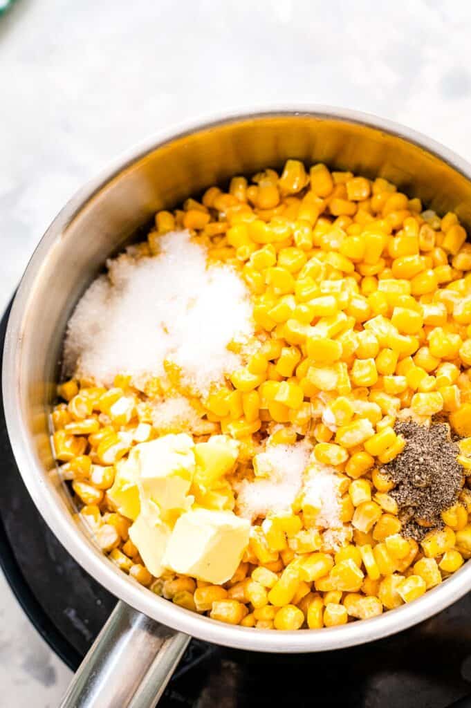 Corn, salt, pepper, sugar in a saucepan