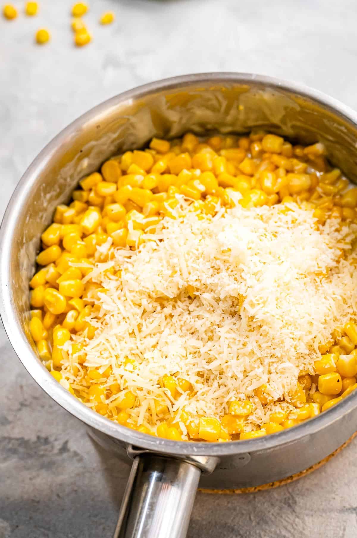 Corn with Parmesan on it in a saucepan