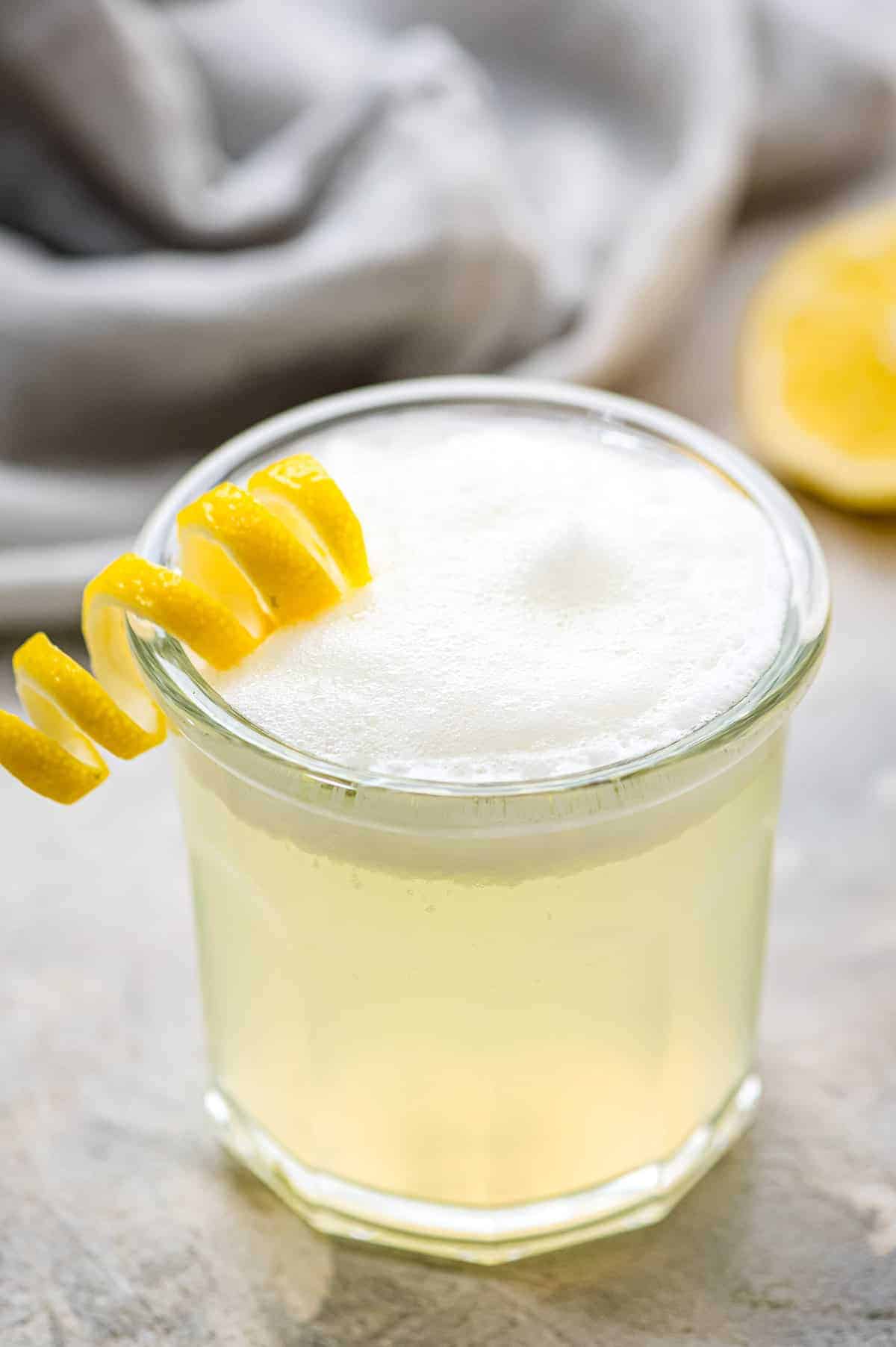 Classic Gin Fizz in cocktail glass with foamy top