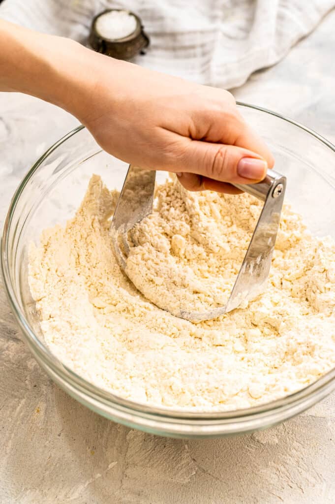 Cutting butter into flour in glass bowl