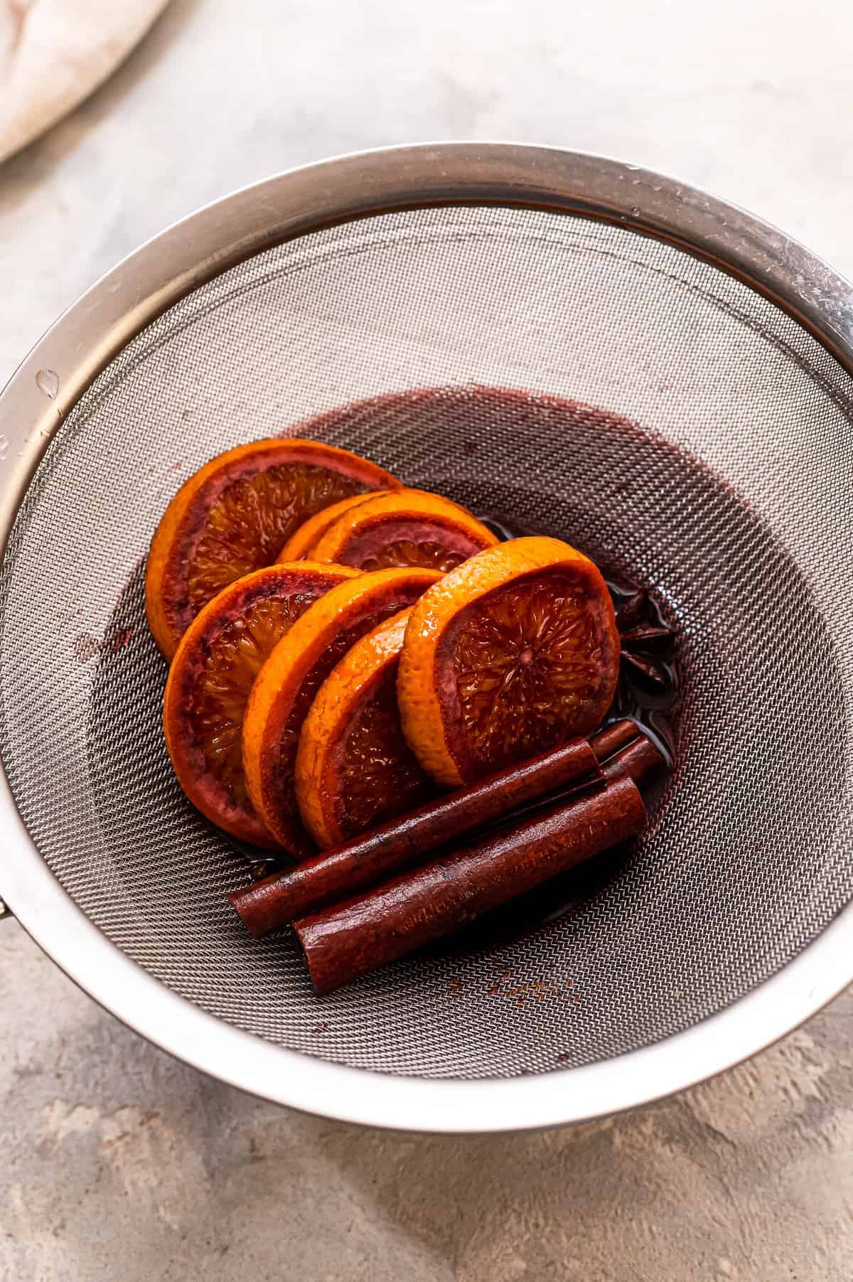 Straining mulled wine with mesh strainer