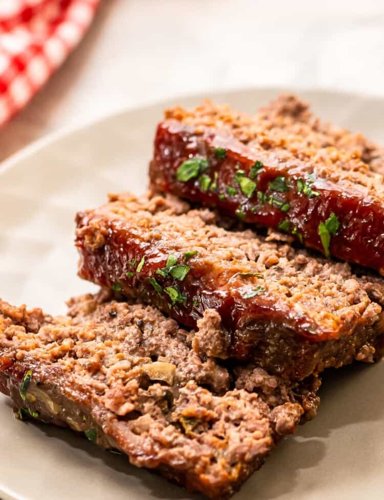 three slices of meatloaf on serving plate