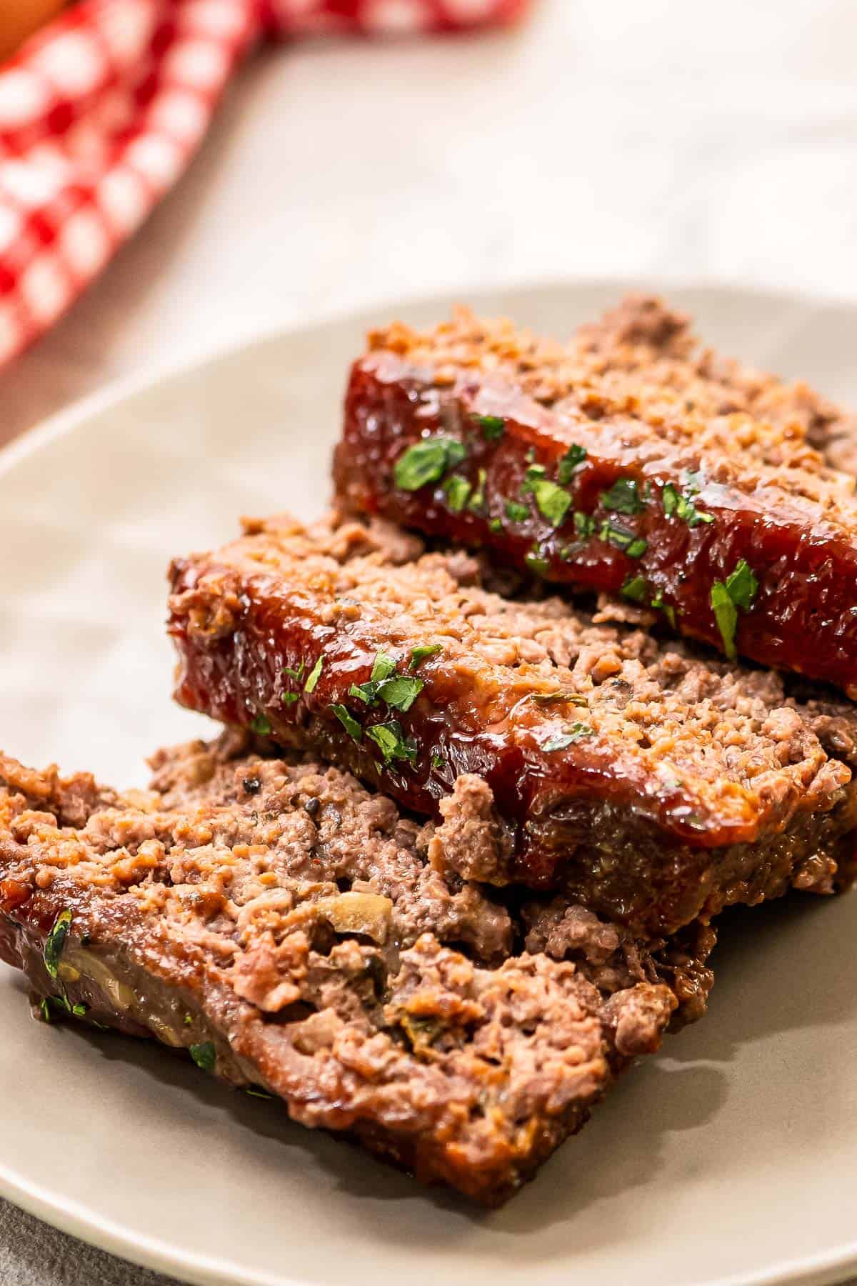 three slices of meatloaf on serving plate