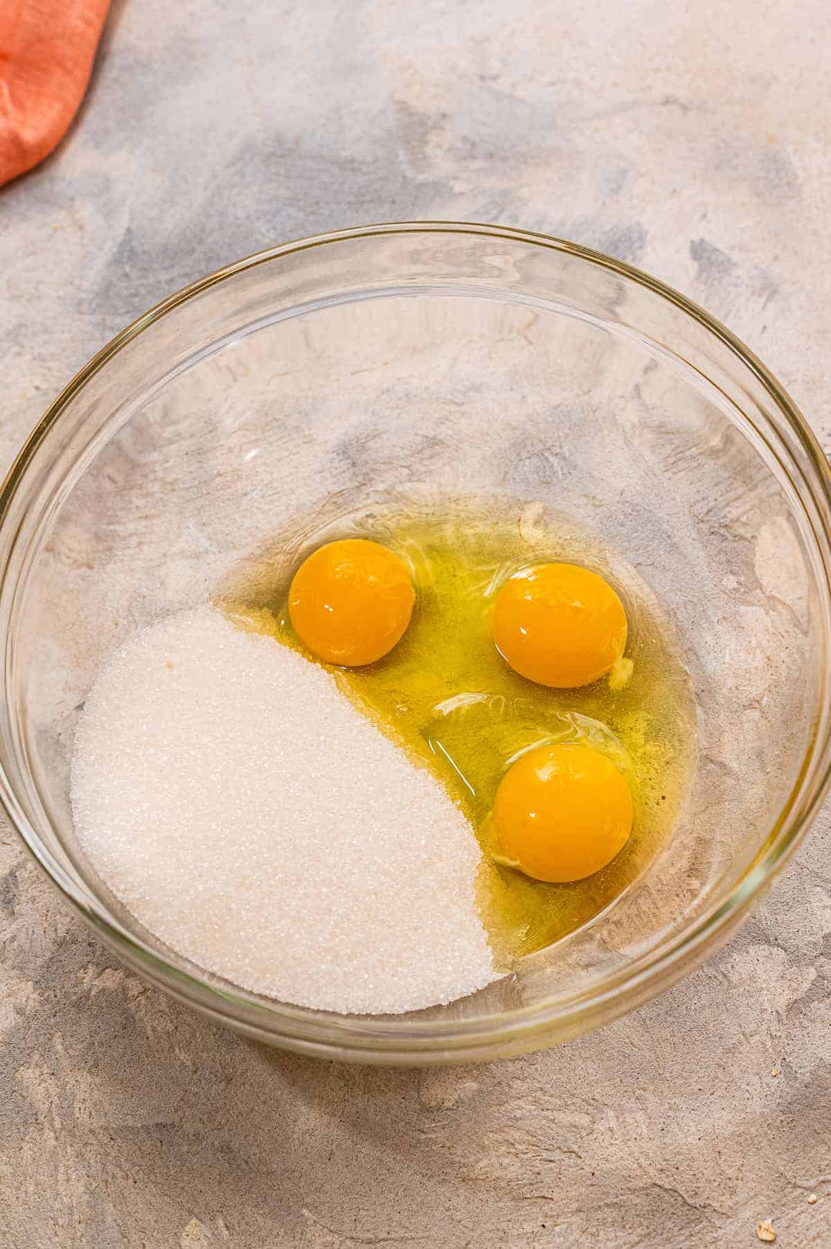 Glass bowl with sugar and eggs