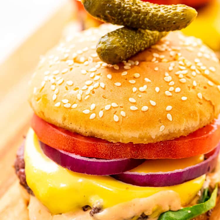 Cheeseburger with condiments on bun