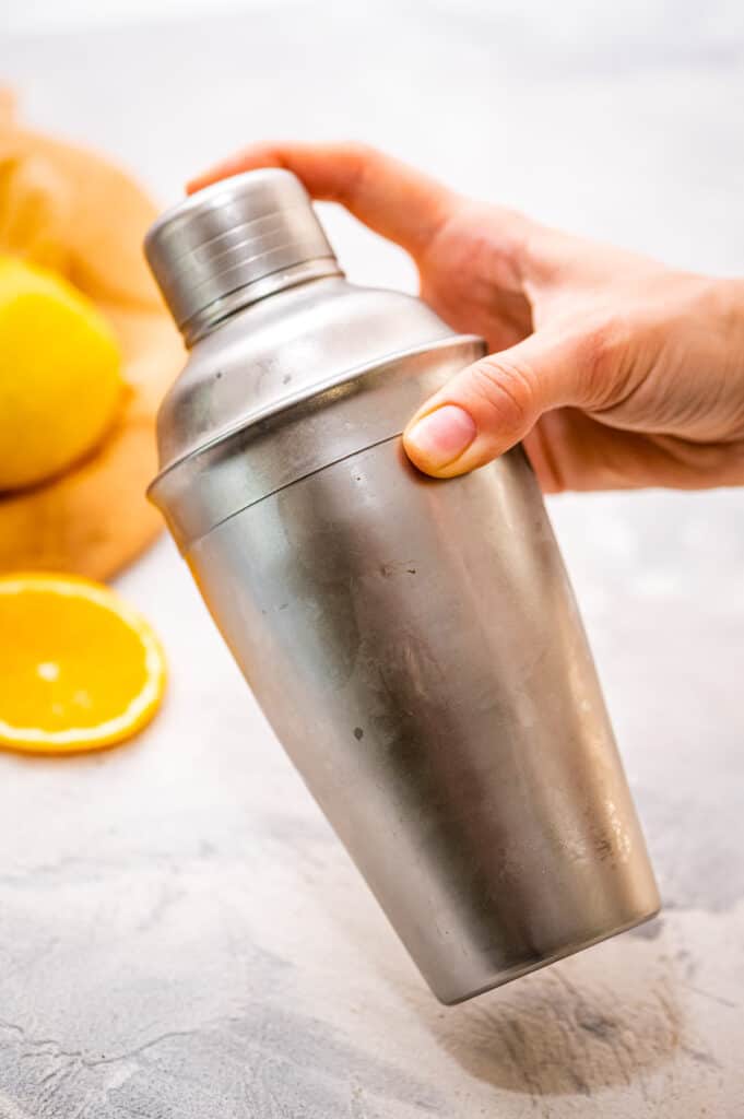 Hand shaking a cocktail shaker