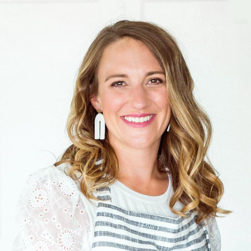 Head shot of Julie with striped apron on