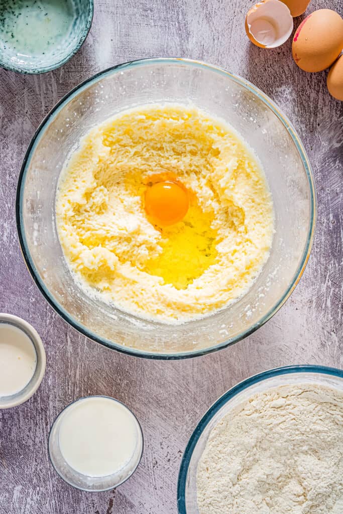 Overhead Image of of egg added to wet ingredients for cupcakes