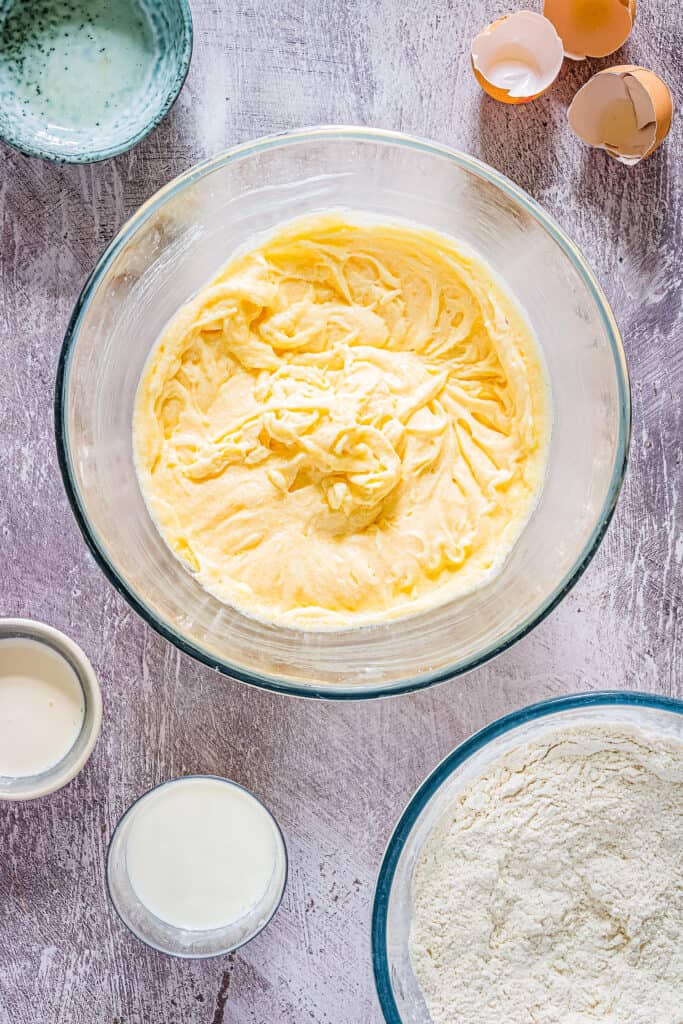 Overhead image of wet ingredients combined in glass bowl for cupcakes