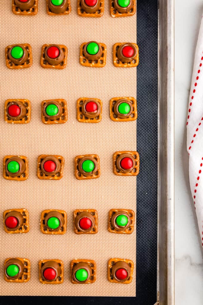 Sheet pan with prepared Rolo Pretzels on it