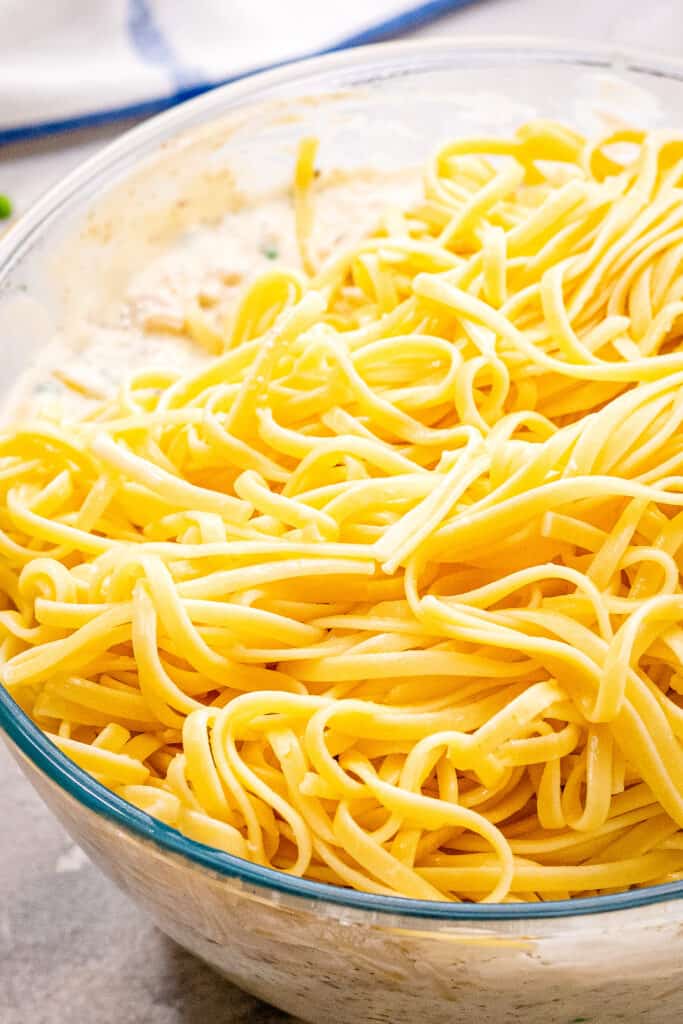 Adding linguine to creamy mixture for casserole