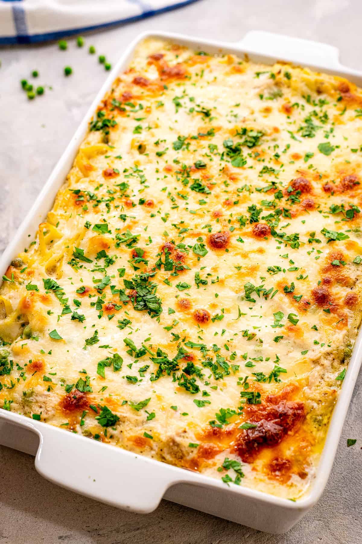 Turkey Tetrazzini baked in a white casserole dish