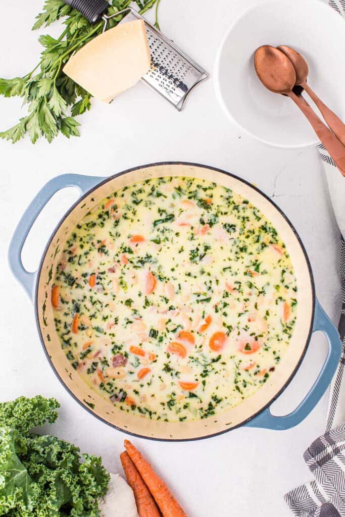 Overhead image of white bean soup in dutch oven
