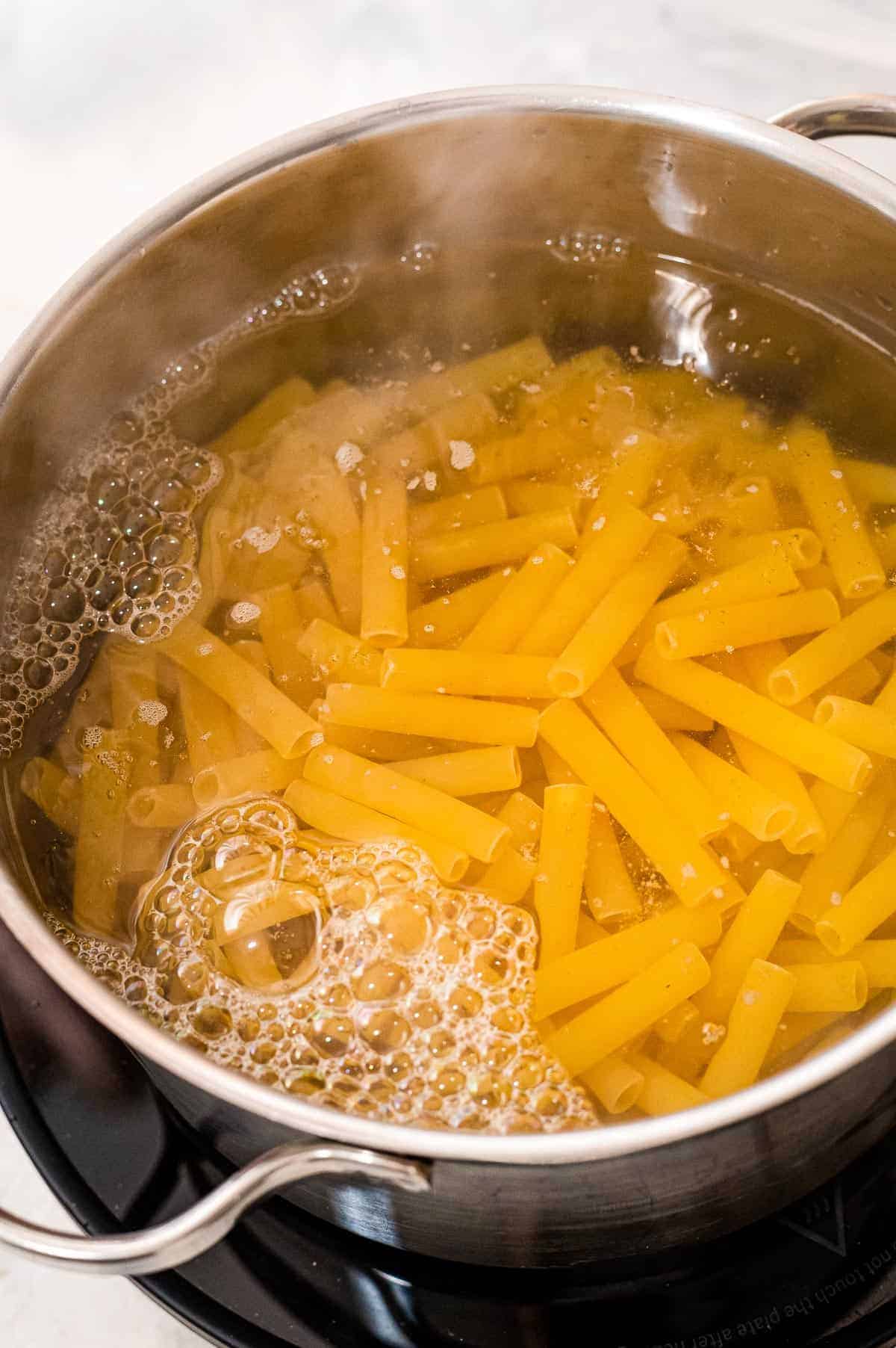 Saucepan boiling ziti pasta