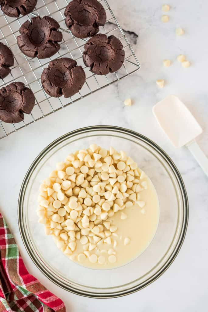 Glass bowl with white chocolate chips and sweetened condensed milk