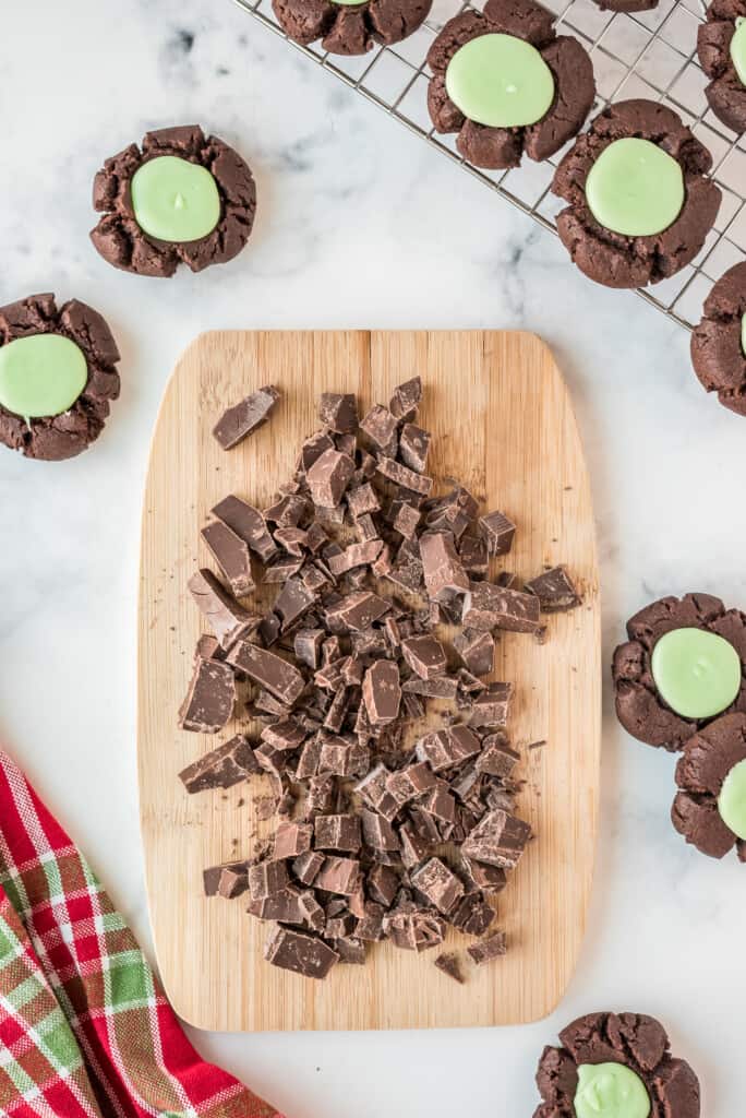 Chopped chocolate on wood cutting board