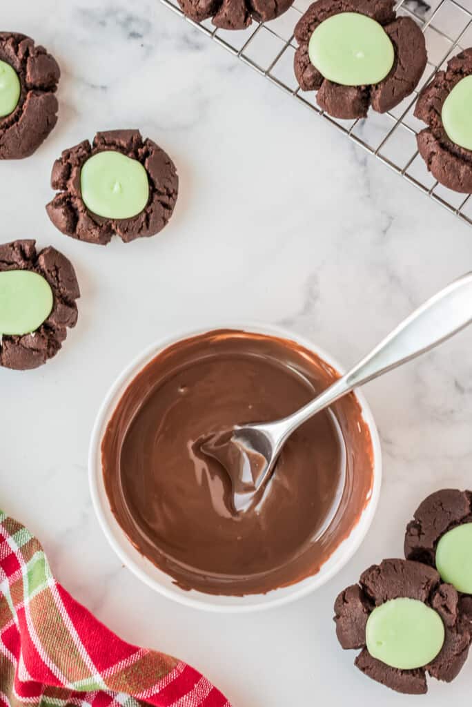 Melted chocolate in glass bowl with spoon