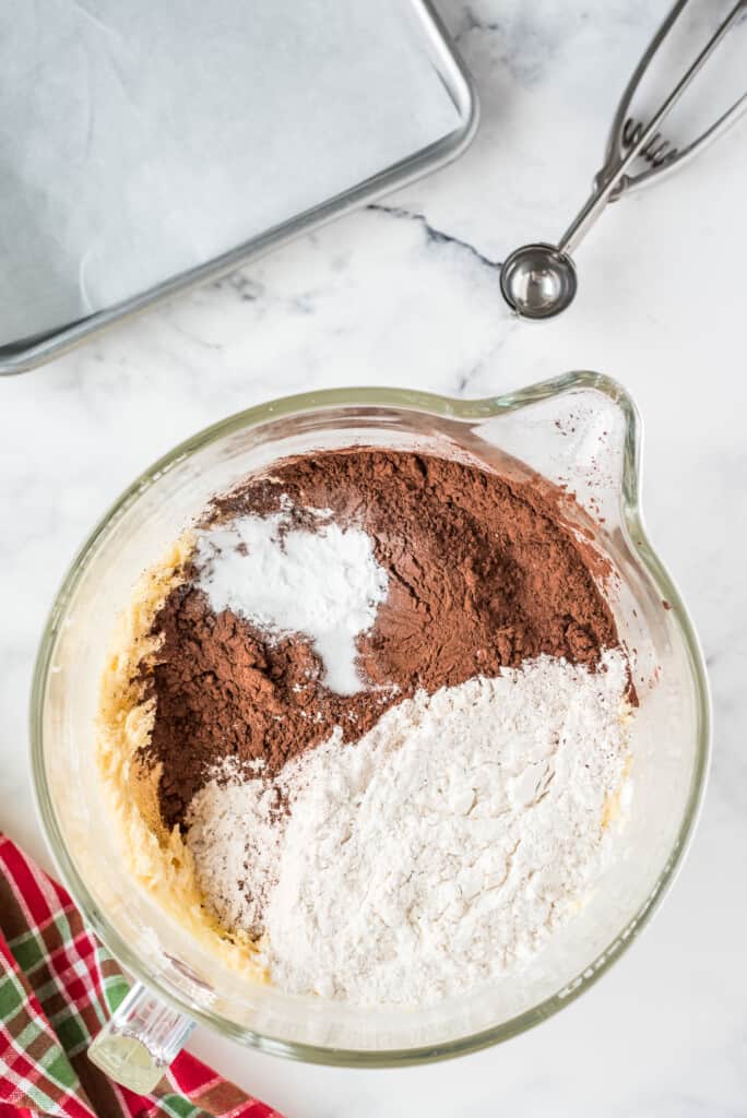 Glass bowl with cocoa, flour and baking soda