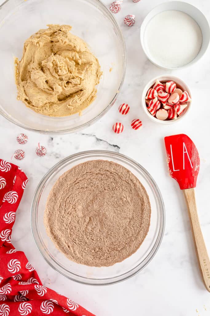 Glass mixing bowl with cocoa powder and flour mixed together