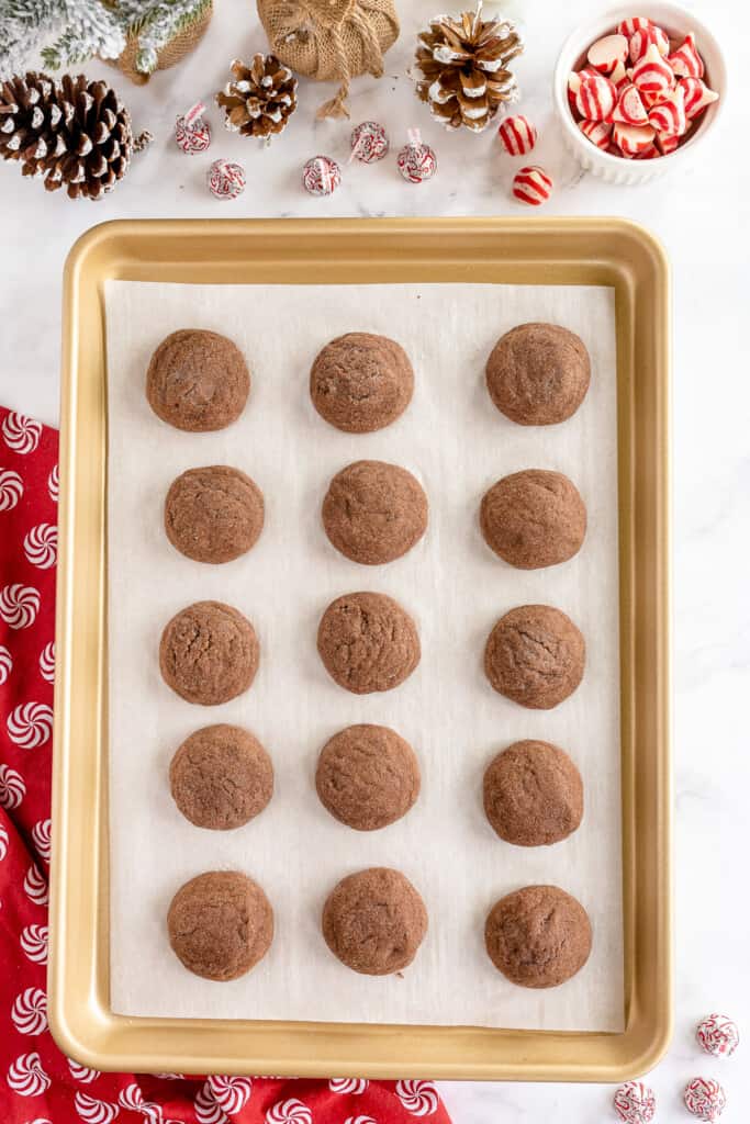Sheet pan with baked chocolate thumbprint cookies