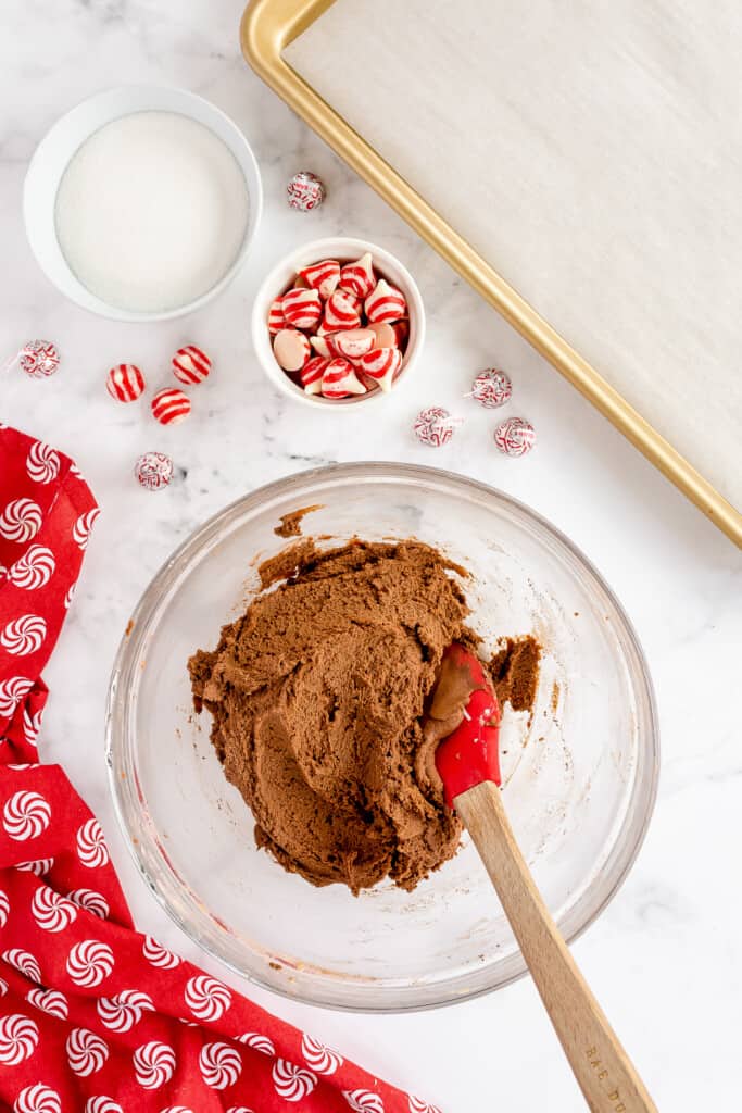 Chocolate Thumbprint cookie dough mixed together in glass bowl