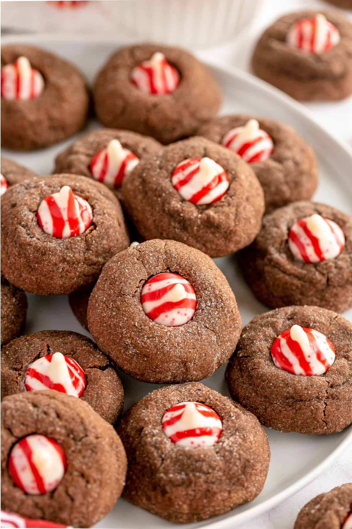 White plate with Chocolate Peppermint Kiss Cookies on it