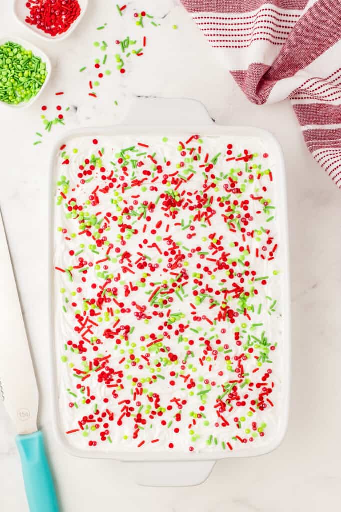 Overhead image of Christmas Poke Cake white sprinkles