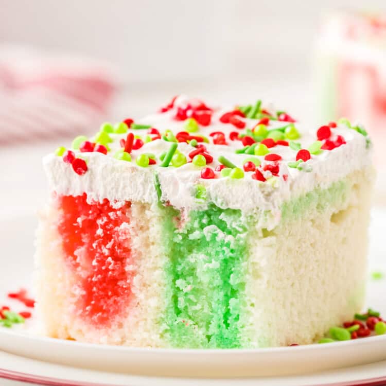 Christmas Poke Cake piece on a plate