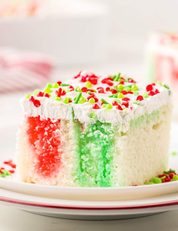 Christmas Poke Cake piece on a plate