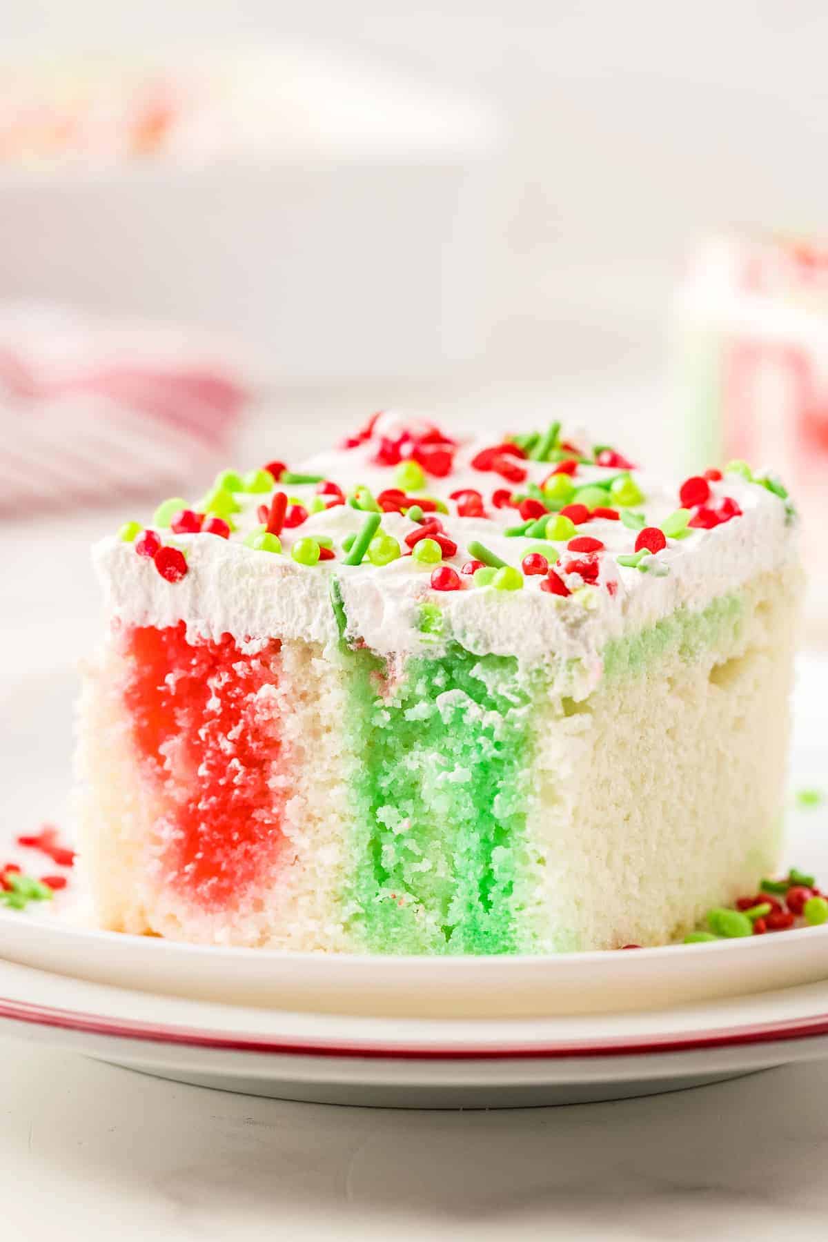 Christmas Poke Cake piece on a plate