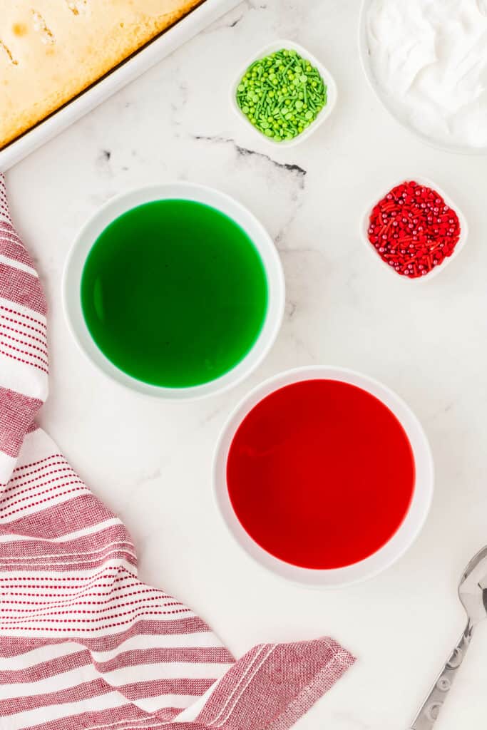 Overhead image of red and green jello mixed with water