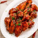 Crock Pot Chicken Wings on a white plate Square cropped image