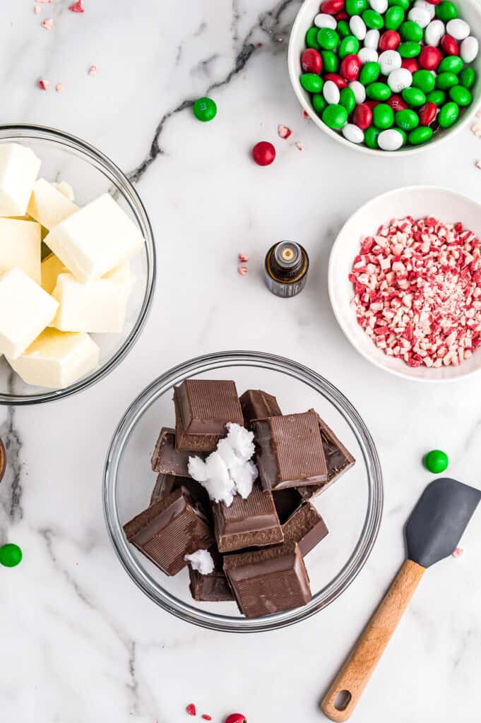 Bowl of chocolate almond bark and coconut oil in bowl