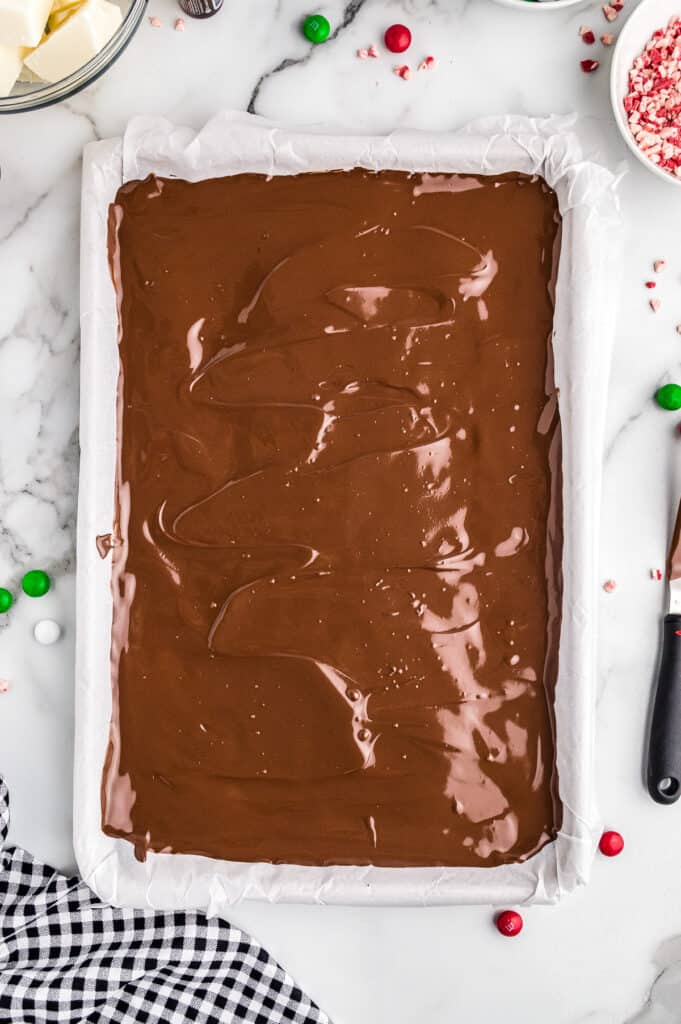 Melted chocolate almond bark in sheet pan