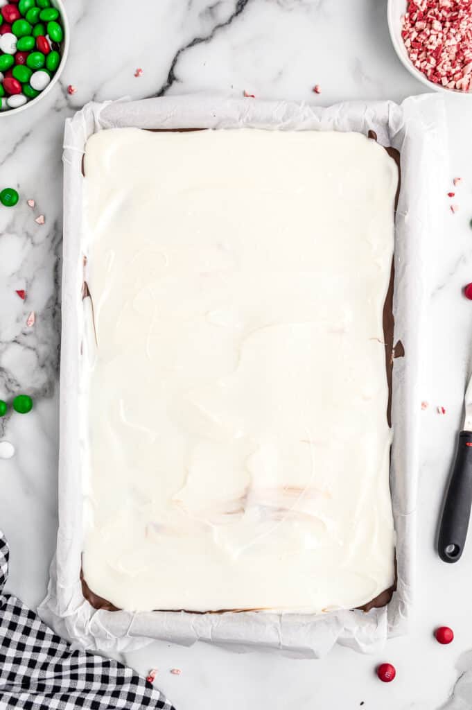Melted white almond bark in sheet pan
