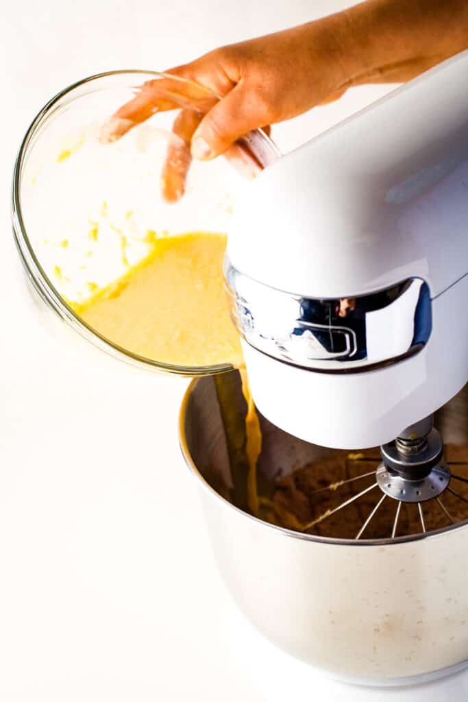 Adding wet ingredients to mixing bowl