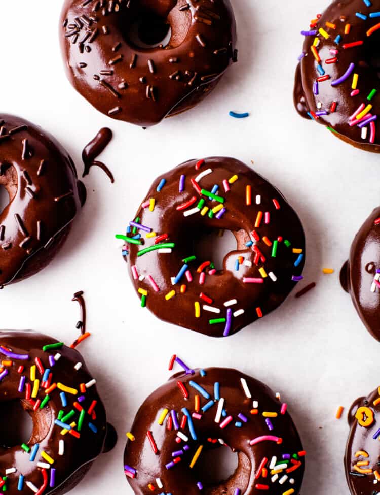 Overhead image of Frosted Baked Chocolate Donuts with sprinkles