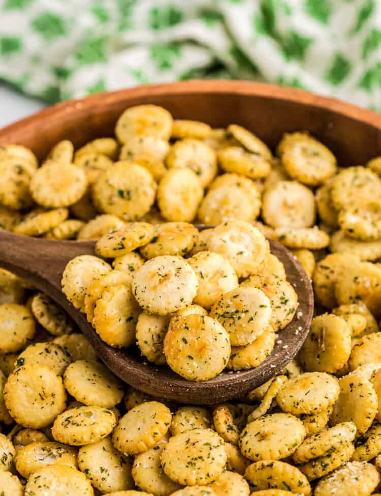 Bowl with wooden spoon full of Ranch Oyster Crackers