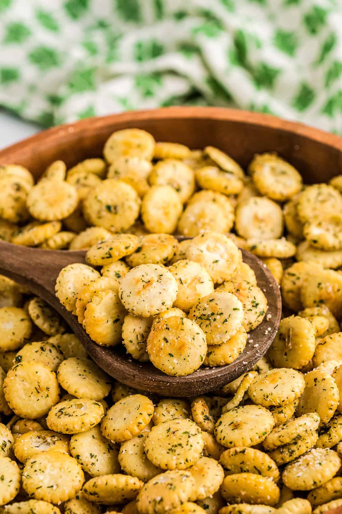 Bowl with wooden spoon full of Ranch Oyster Crackers