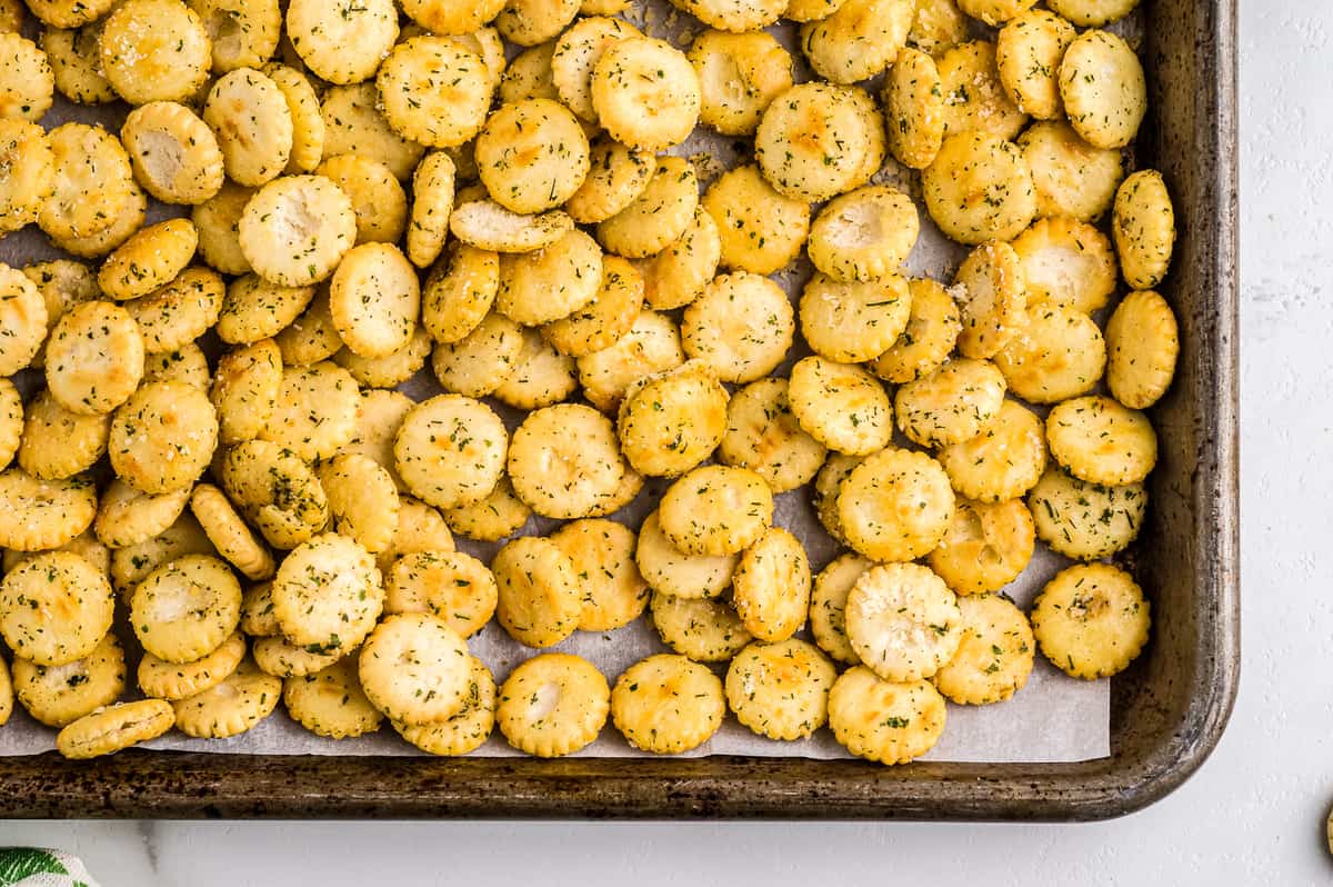 Close up image of sheet pan corner with ranch oyster crackers