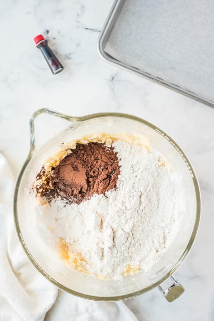 Adding cocoa and flour to cookie dough