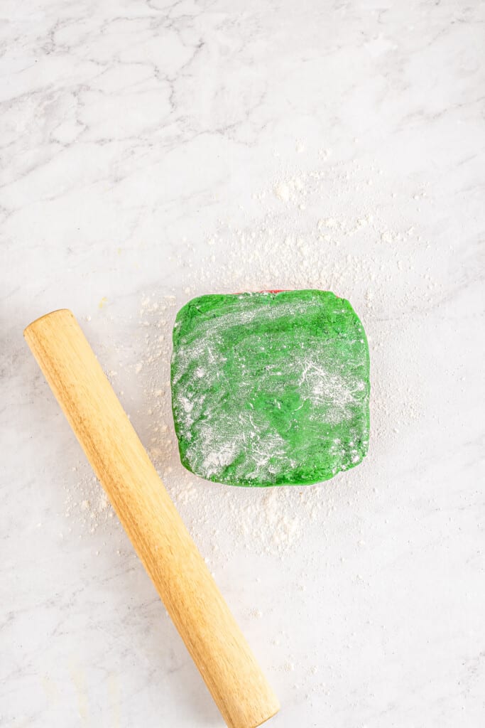 Rolling pin with green cookie dough