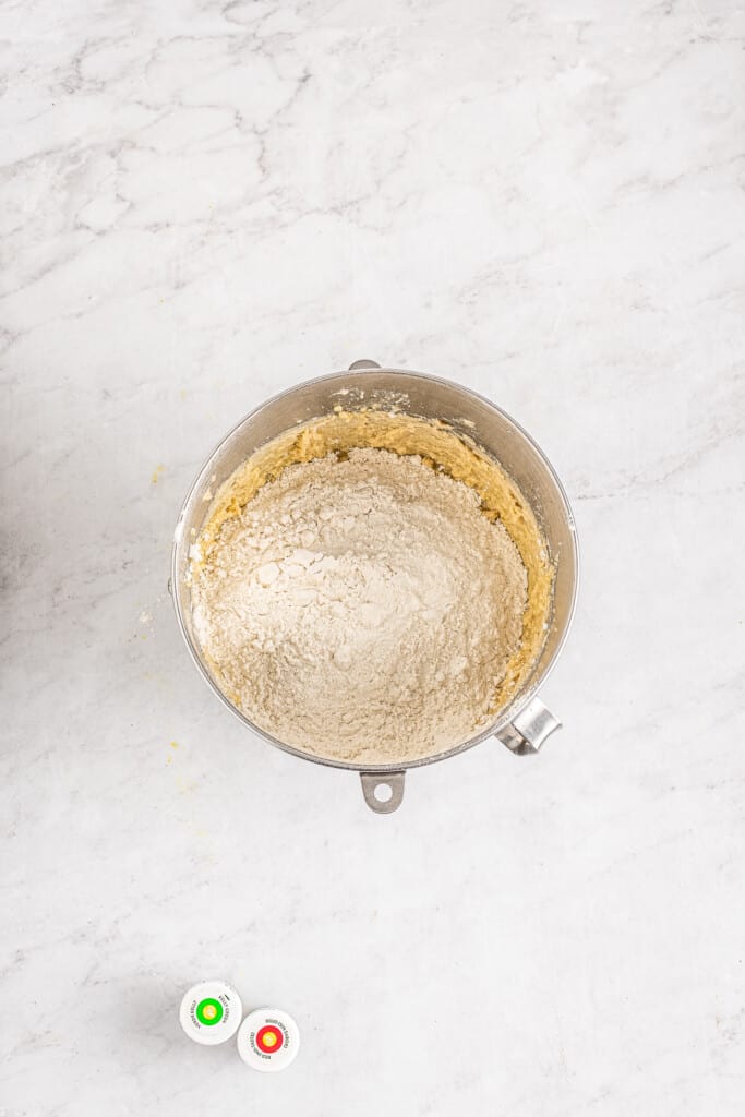 Overhead image adding dry and wet ingredients for cookies