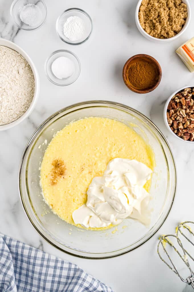 Overhead image of sour cream being added to wet mixture