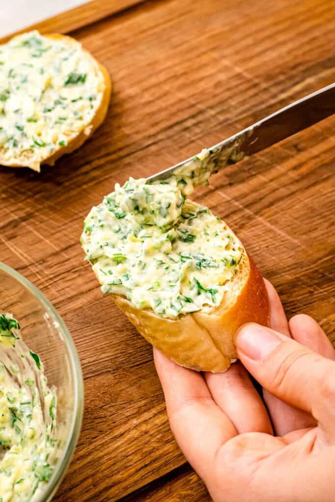 Spread garlic butter mixture on French Bread piece