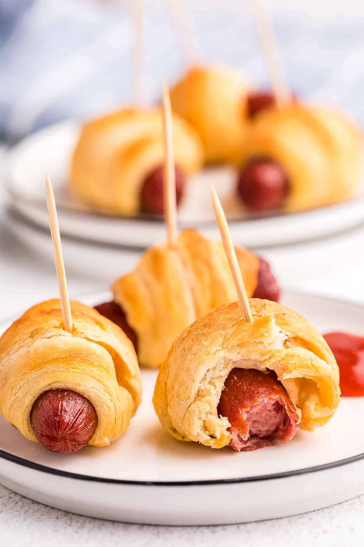 White plate with mini pigs on a blanket